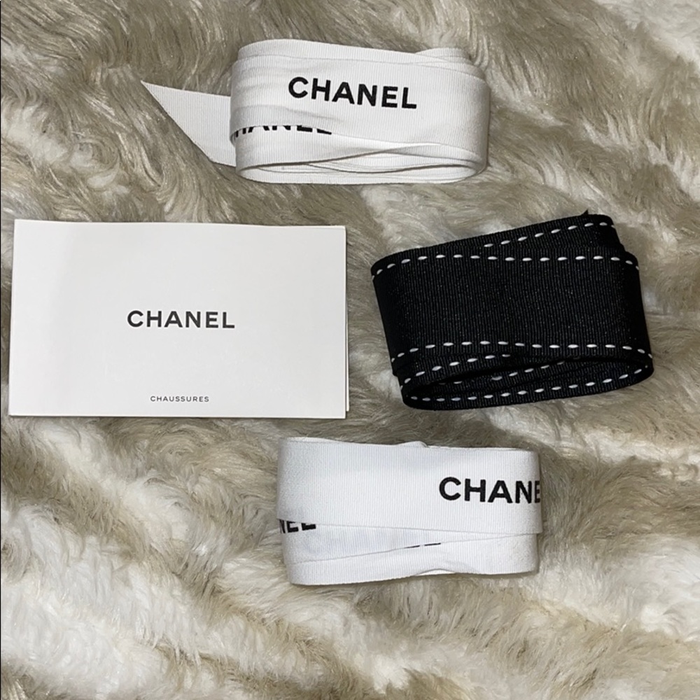 Chanel ribbons and care booklet.